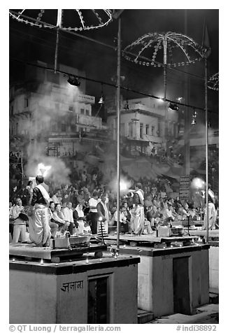 Holy hindu men facing audience during evening arti ceremony. Varanasi, Uttar Pradesh, India