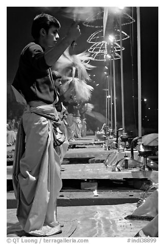 Young Brahman performing arti ceremony. Varanasi, Uttar Pradesh, India (black and white)