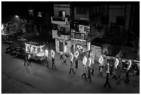 Street wedding procession bright lights seen from above. Varanasi, Uttar Pradesh, India (black and white)