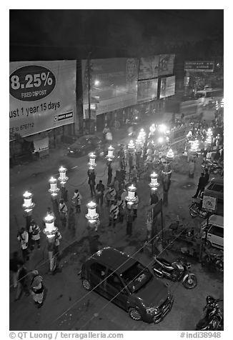 Street and wedding procession by night from above. Varanasi, Uttar Pradesh, India (black and white)