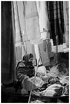 Woman selling fabrics at night. Varanasi, Uttar Pradesh, India ( black and white)