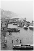 Pilgrims taking a holy dip in the Ganga River at dawn. Varanasi, Uttar Pradesh, India (black and white)