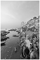 People worshipping Ganges River, early morning. Varanasi, Uttar Pradesh, India (black and white)