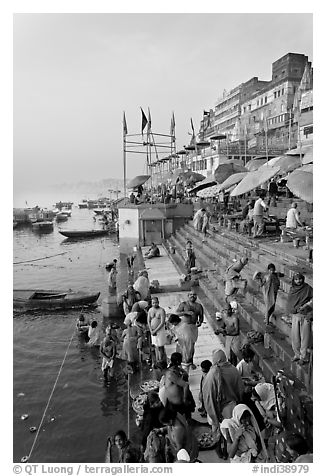 People about to bathe in the Ganga River at sunrise. Varanasi, Uttar Pradesh, India