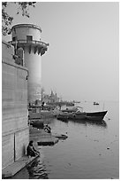 Man sitting on edge of Ganges River. Varanasi, Uttar Pradesh, India ( black and white)