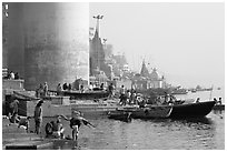 Ganges riverbank with men bathing. Varanasi, Uttar Pradesh, India (black and white)