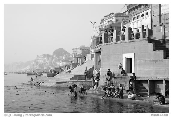 Men dipping in Ganga River at Meer Ghat. Varanasi, Uttar Pradesh, India (black and white)