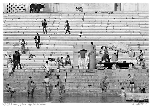 Men finishing their bath below the steps of Scindhia Ghat. Varanasi, Uttar Pradesh, India (black and white)