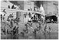 Hindu people on the steps of Sankatha Ghat. Varanasi, Uttar Pradesh, India (black and white)