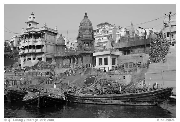 Huge piles of firewood stacked at Manikarnika Ghat. Varanasi, Uttar Pradesh, India (black and white)