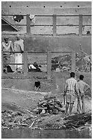 Men attending to cremation, Manikarnika Ghat. Varanasi, Uttar Pradesh, India ( black and white)