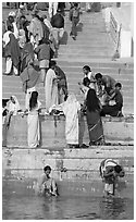 Women rinsing in river Ganges water. Varanasi, Uttar Pradesh, India (black and white)