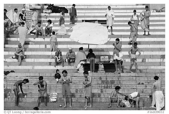 Men after bath on steps of Meer Ghat. Varanasi, Uttar Pradesh, India (black and white)