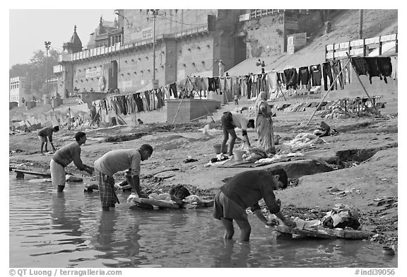 Men washing laundry on Ganga riverbanks. Varanasi, Uttar Pradesh, India (black and white)