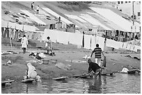 Washing and drying laundry on Ganga riverbank. Varanasi, Uttar Pradesh, India ( black and white)