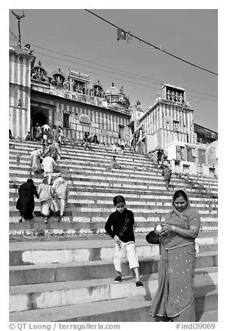 Woman and boy on temple steps, Kedar Ghat. Varanasi, Uttar Pradesh, India (black and white)