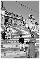 Woman and boy on temple steps, Kedar Ghat. Varanasi, Uttar Pradesh, India (black and white)