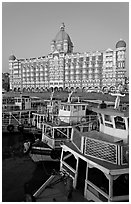 Tour boats in front of Taj Mahal Palace Hotel. Mumbai, Maharashtra, India ( black and white)