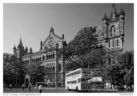 Yellow double-decker bus in front of Victoria Terminus. Mumbai, Maharashtra, India