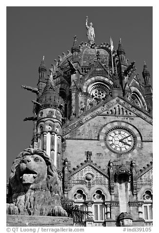 Lion and Gothic tower topped by 4m-high statue of Progress, Victoria Terminus. Mumbai, Maharashtra, India