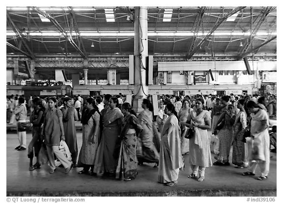 Women on train platform, Victoria Terminus. Mumbai, Maharashtra, India (black and white)