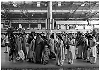 Women on train platform, Victoria Terminus. Mumbai, Maharashtra, India (black and white)