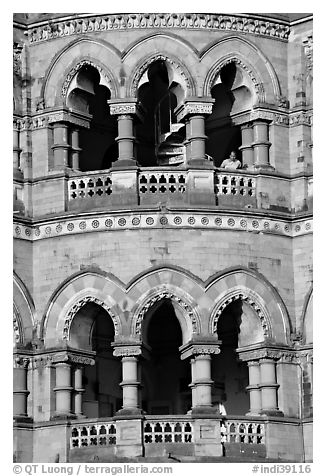 Facade with woman at window, Chhatrapati Shivaji Terminus. Mumbai, Maharashtra, India