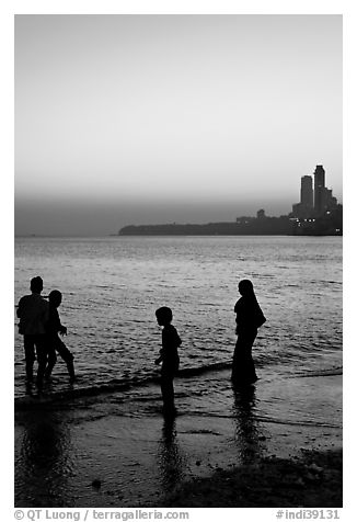 Beachgoers and skyline, Chowpatty Beach. Mumbai, Maharashtra, India