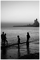 Beachgoers and skyline, Chowpatty Beach. Mumbai, Maharashtra, India ( black and white)