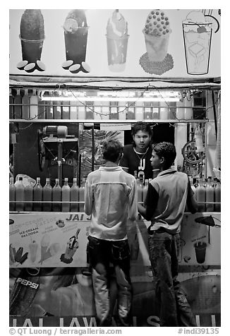 Stall with colorful drinks, Chowpatty Beach. Mumbai, Maharashtra, India (black and white)