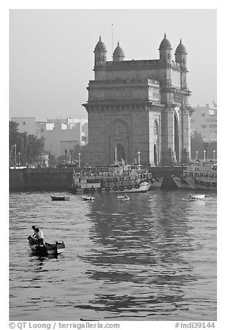 Small boat and Gateway of India, early morning. Mumbai, Maharashtra, India (black and white)