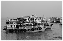 Tour boat at twilight. Mumbai, Maharashtra, India (black and white)