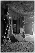 Figures of Dwarpala on Shiva shrine, Elephanta caves. Mumbai, Maharashtra, India (black and white)