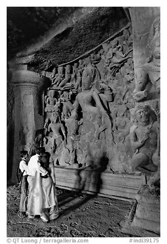 Family looking at Ardhanarishwar Siva sculpture, main Elephanta cave. Mumbai, Maharashtra, India