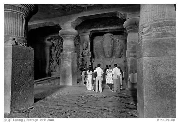 Vistors in main cave, Elephanta Island. Mumbai, Maharashtra, India