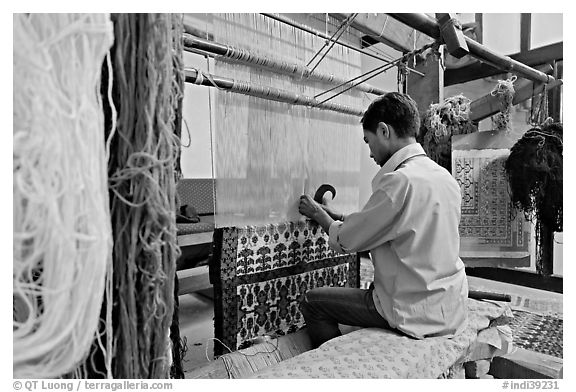 Man weaving a carpet. Agra, Uttar Pradesh, India (black and white)