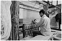 Man weaving a carpet. Agra, Uttar Pradesh, India (black and white)