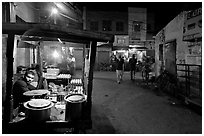 Food vendor and street by night, Taj Ganj. Agra, Uttar Pradesh, India (black and white)