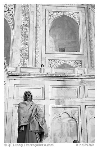 Woman standing at the base of Taj Mahal. Agra, Uttar Pradesh, India (black and white)