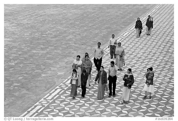 Families walking on decorated terrace, Taj Mahal. Agra, Uttar Pradesh, India (black and white)