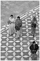 Women walking on decorated terrace, Taj Mahal. Agra, Uttar Pradesh, India (black and white)