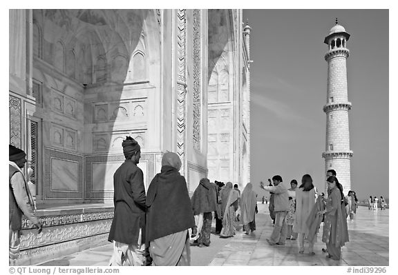 Colorful tourists on the platform, Taj Mahal,. Agra, Uttar Pradesh, India (black and white)
