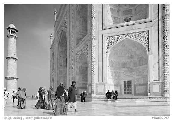 Base of Taj Mahal, minaret, and tourists. Agra, Uttar Pradesh, India (black and white)