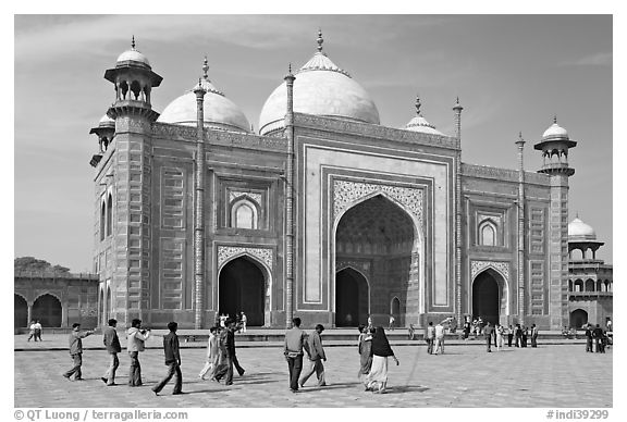 Taj Mahal masjid with people strolling. Agra, Uttar Pradesh, India (black and white)