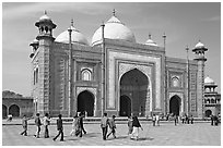 Taj Mahal masjid with people strolling. Agra, Uttar Pradesh, India ( black and white)