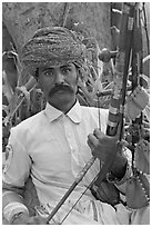 Musician with string instrument. Agra, Uttar Pradesh, India ( black and white)