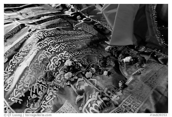 Cloth covering Shaikh Salim Chishti tomb with offered flowers. Fatehpur Sikri, Uttar Pradesh, India (black and white)