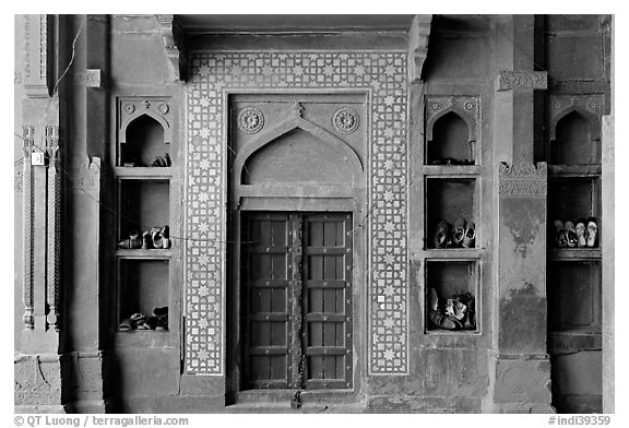 Wall with shoes stored, Dargah mosque. Fatehpur Sikri, Uttar Pradesh, India (black and white)