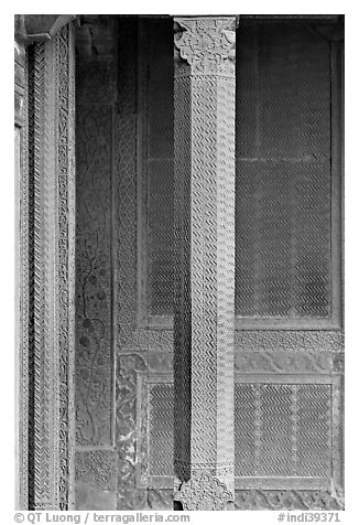 Carved columns and wall of the Rumi Sultana building. Fatehpur Sikri, Uttar Pradesh, India