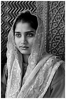 Young woman with embroided scarf, in front of Rumi Sultana wall. Fatehpur Sikri, Uttar Pradesh, India ( black and white)